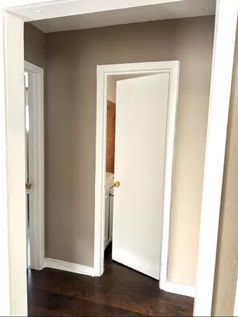 a view of front door with wooden floor