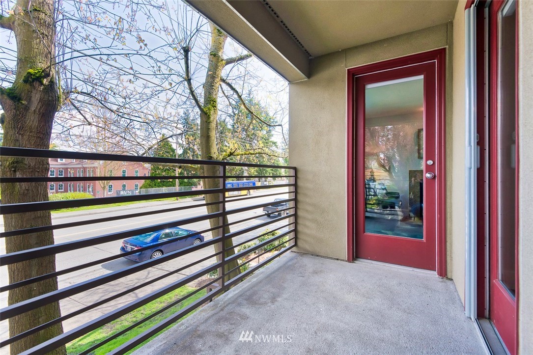 7323 Sand Point Way Northeast, Unit 106 Seattle, WA 98115 - Photo 3 of 21 a view of a bench in front of a building