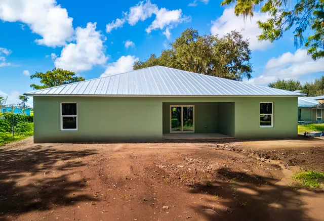 a front view of a house with yard