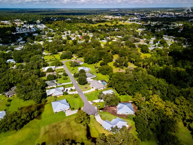 a view of a yard with swimming pool