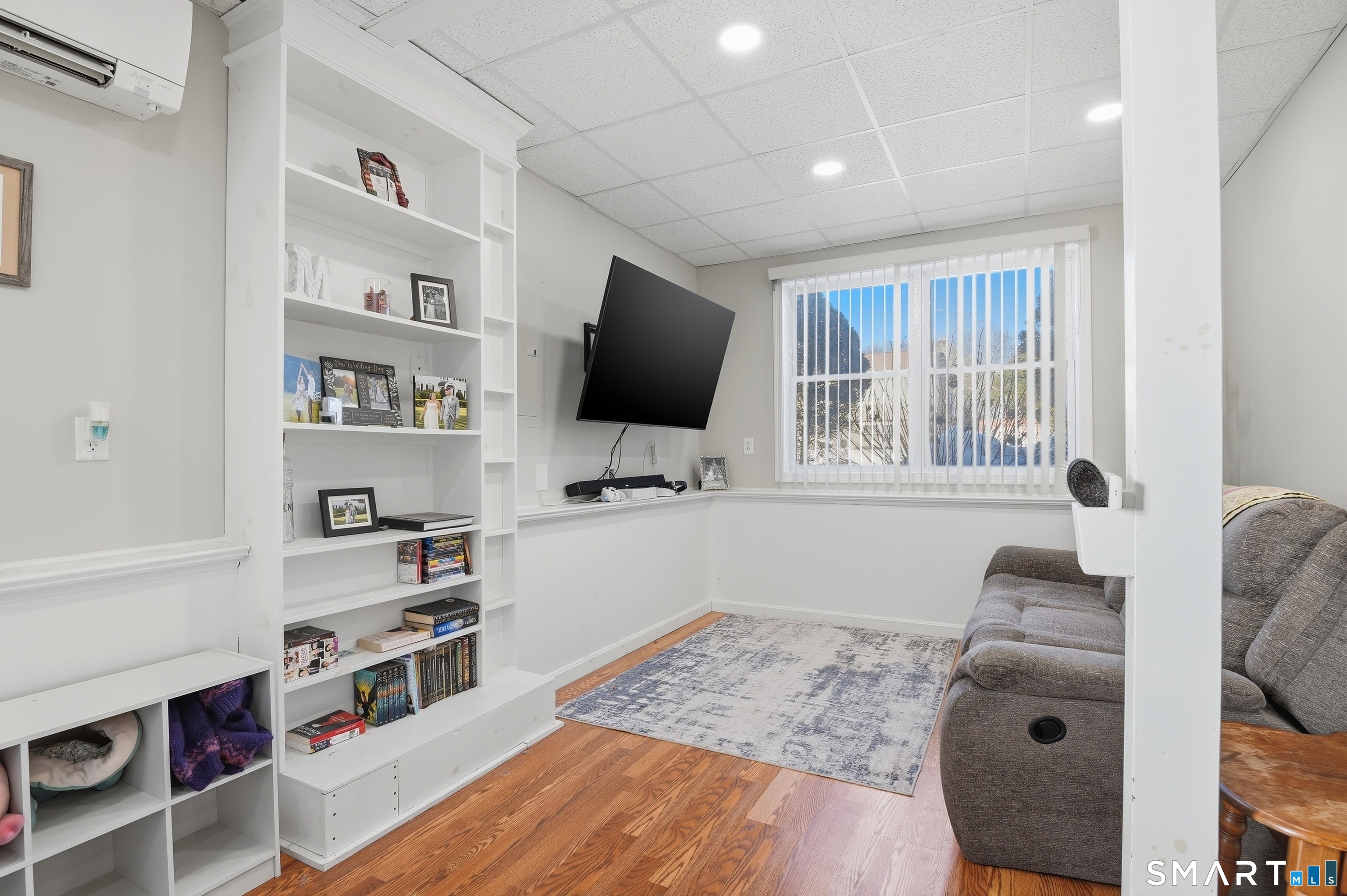 17 Vine Street Putnam, CT 06260 - Photo 11 of 35 a room with furniture a flat screen tv and a window