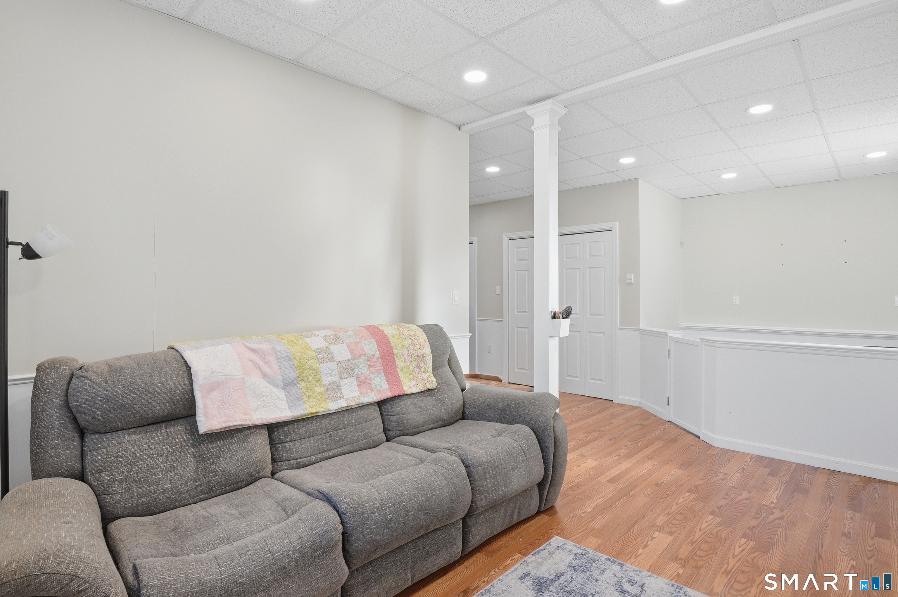 17 Vine Street Putnam, CT 06260 - Photo 13 of 35 a living room with a couch and a rug
