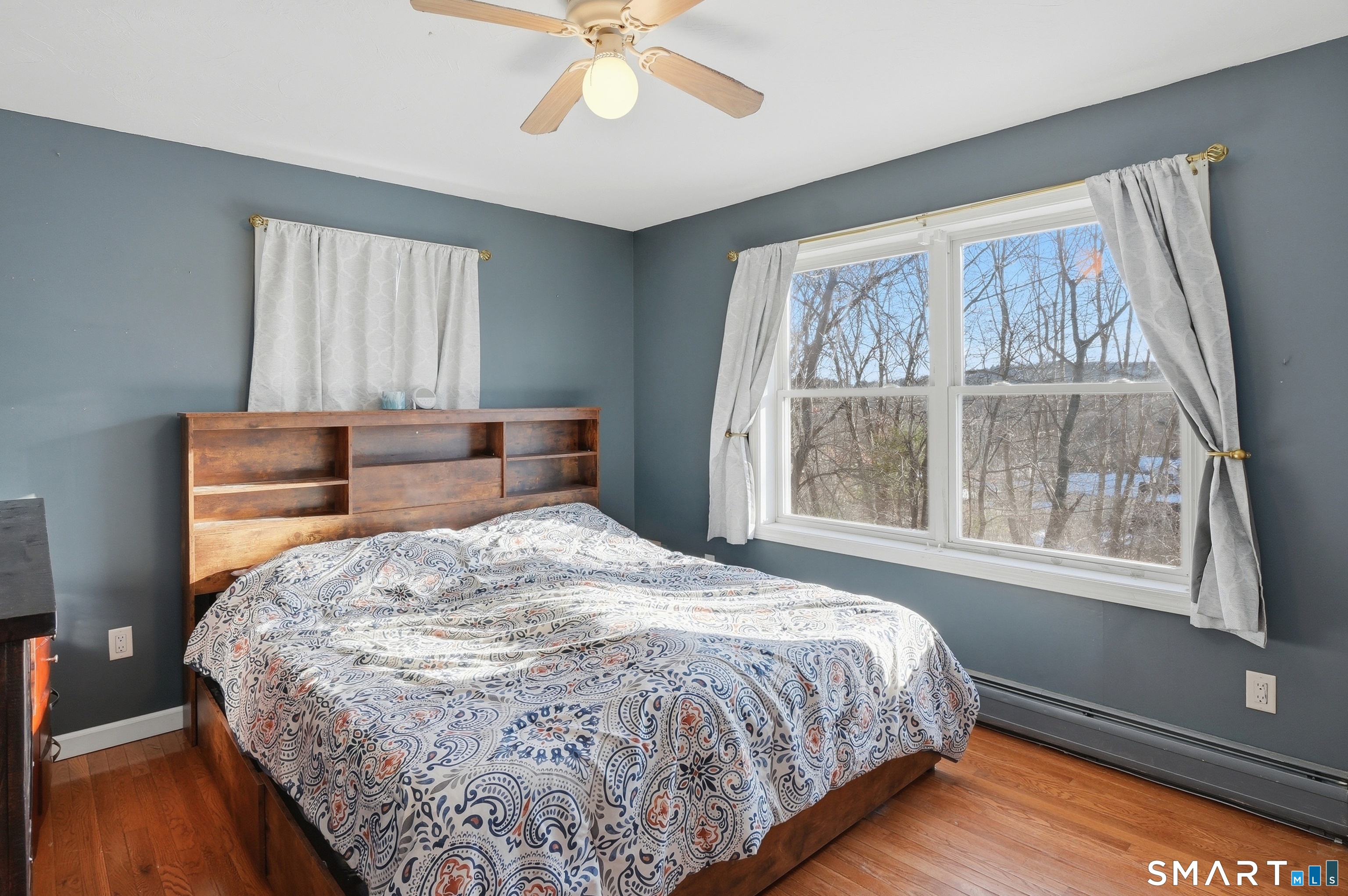 17 Vine Street Putnam, CT 06260 - Photo 16 of 35 a bed sitting in a bedroom next to a window