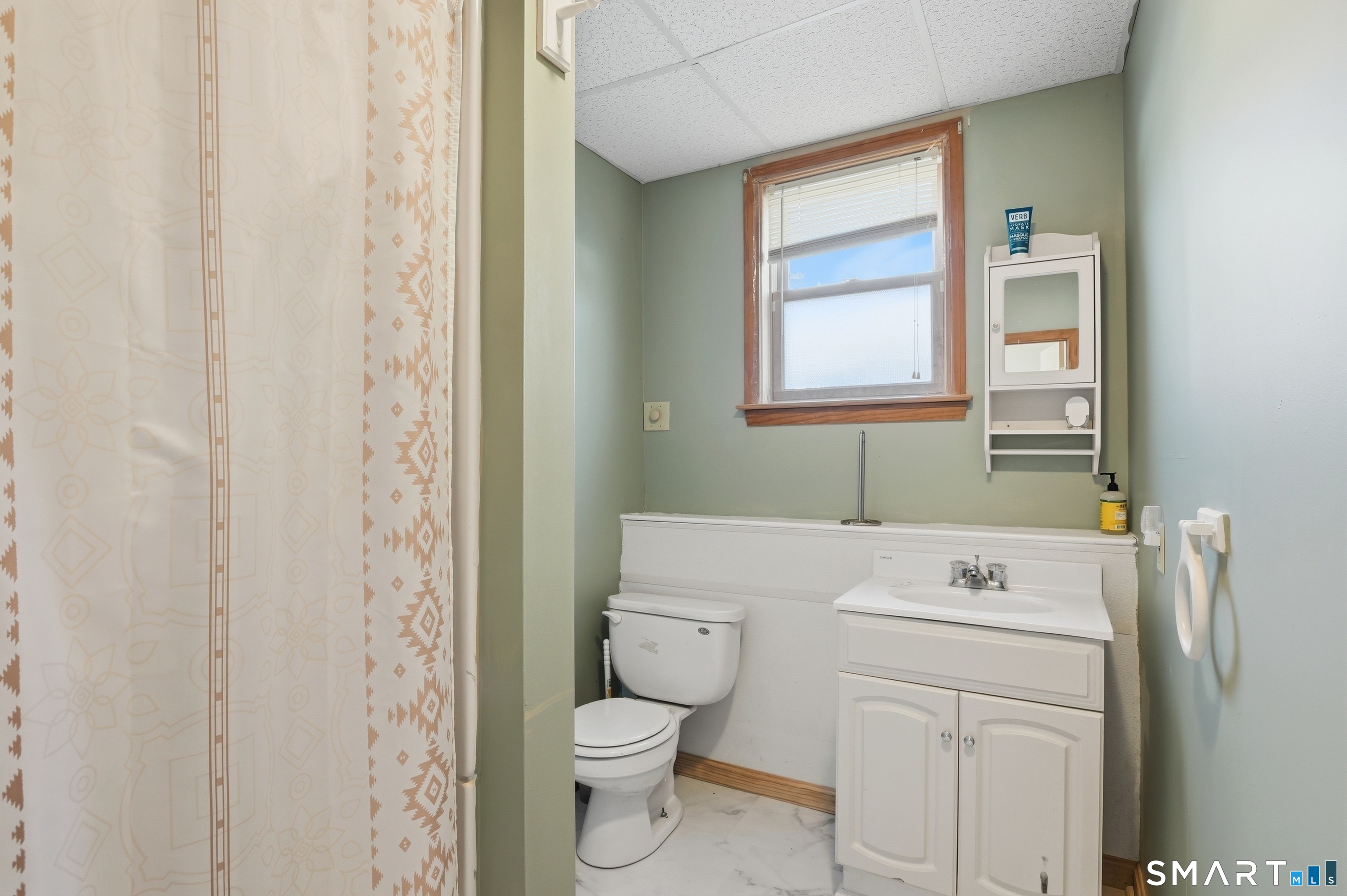 17 Vine Street Putnam, CT 06260 - Photo 26 of 35 a bathroom with a sink a toilet and a window