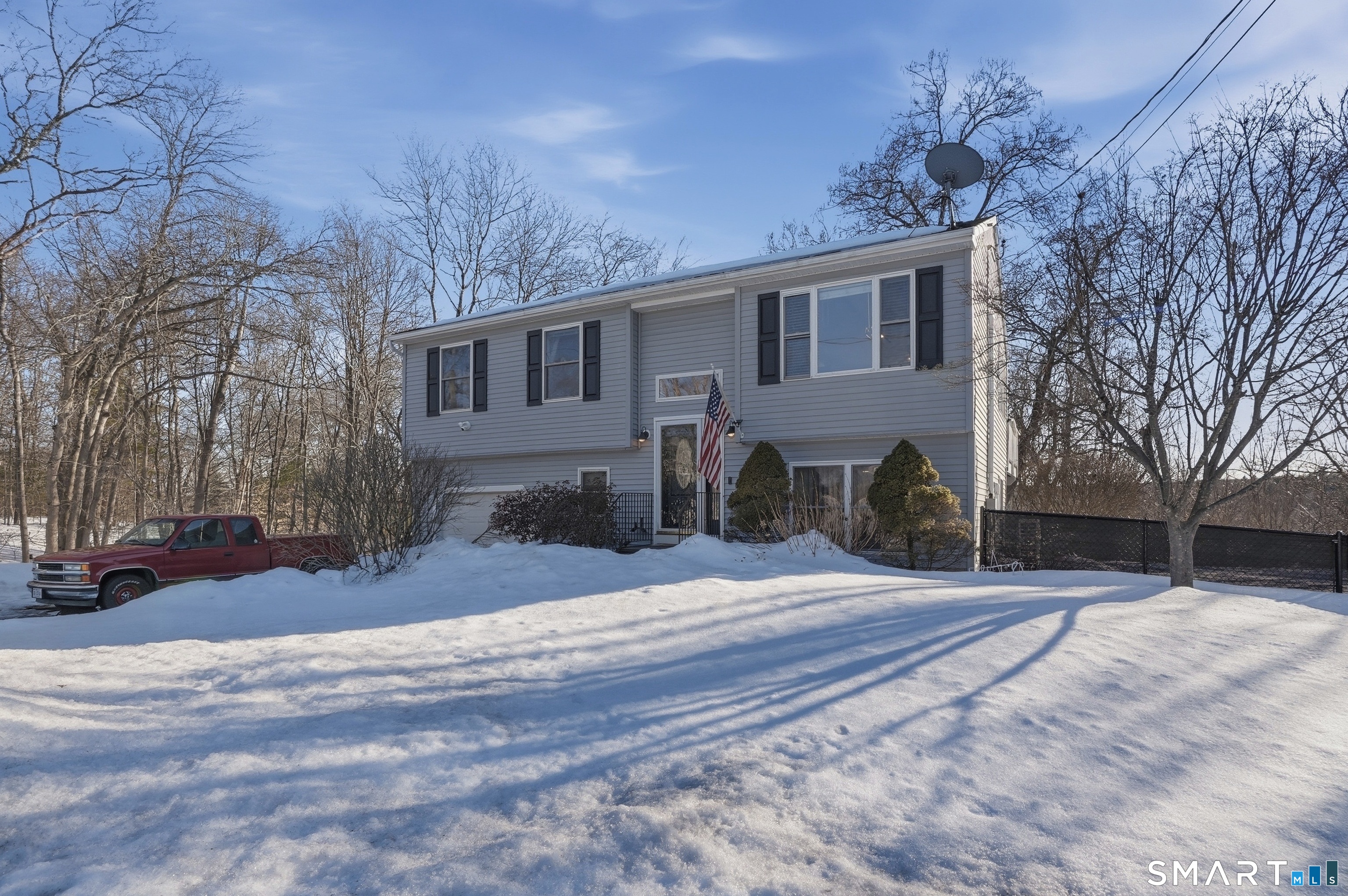 17 Vine Street Putnam, CT 06260 - Photo 32 of 35 a front view of house with yard and trees in the background