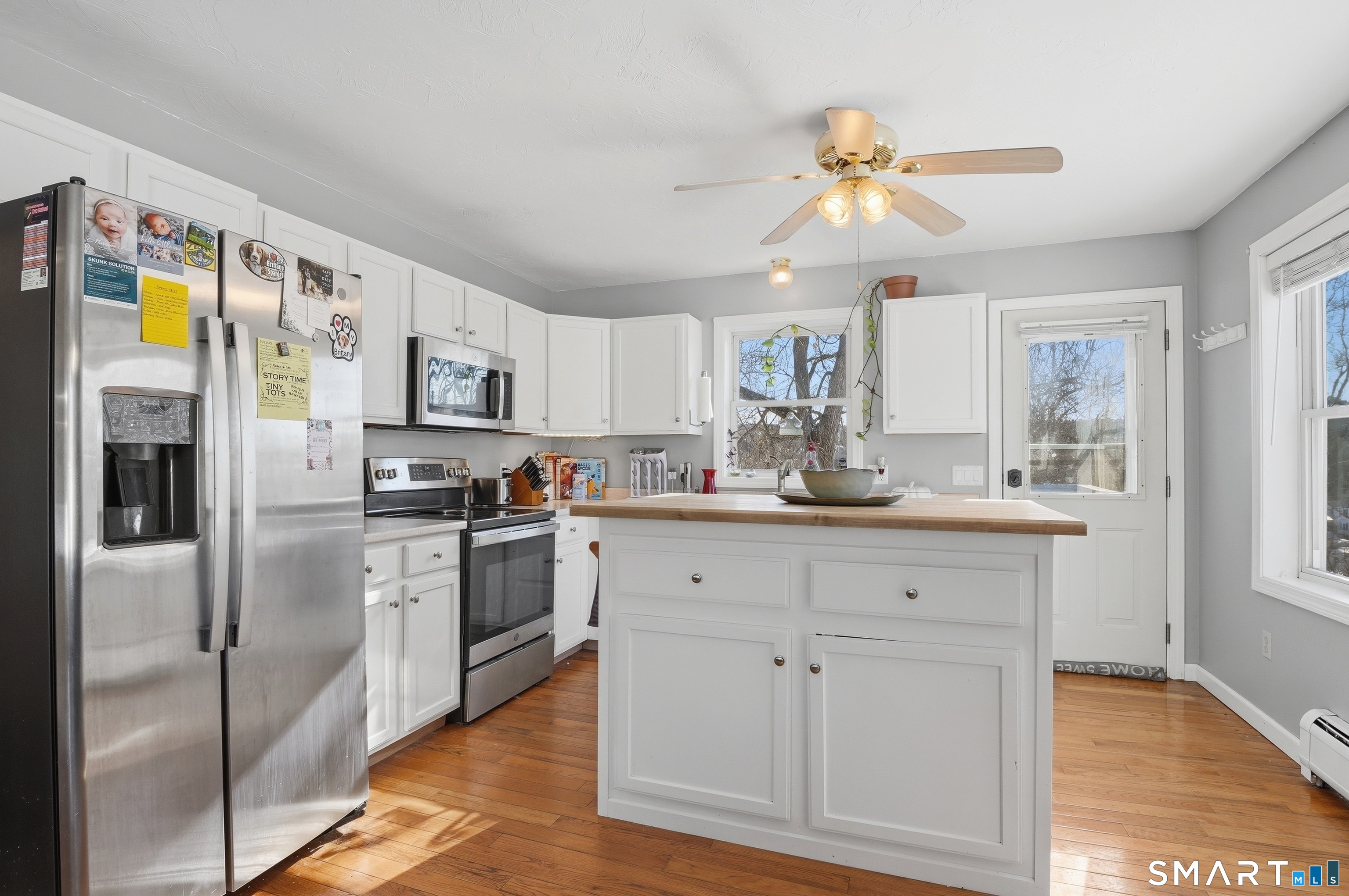 17 Vine Street Putnam, CT 06260 - Photo 5 of 35 a kitchen with stainless steel appliances white cabinets and a refrigerator