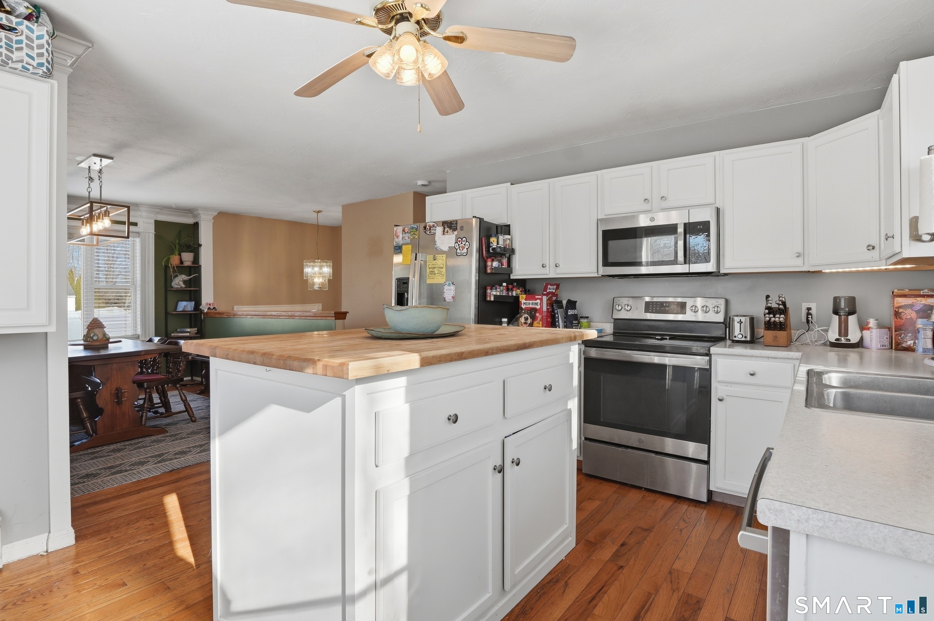 17 Vine Street Putnam, CT 06260 - Photo 6 of 35 a kitchen with kitchen island granite countertop a sink counter top space and stainless steel appliances