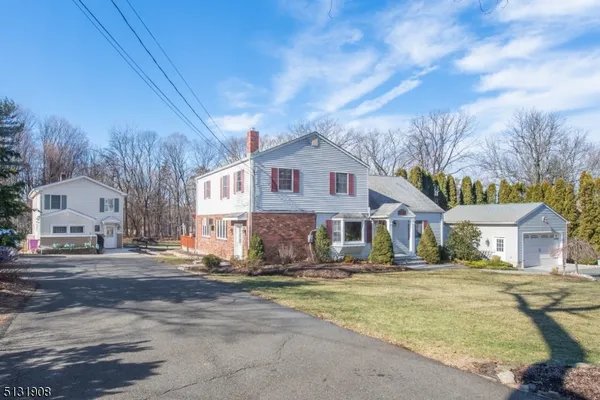 a front view of residential houses with yard
