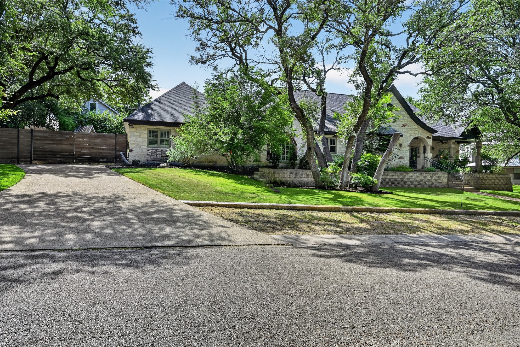 700 Willow Creek Road Salado, TX 76571 - Photo 2 of 39 Expanded driveway and side-entry garage with recent rooof shingles (2023) and refreshed exterior paint.