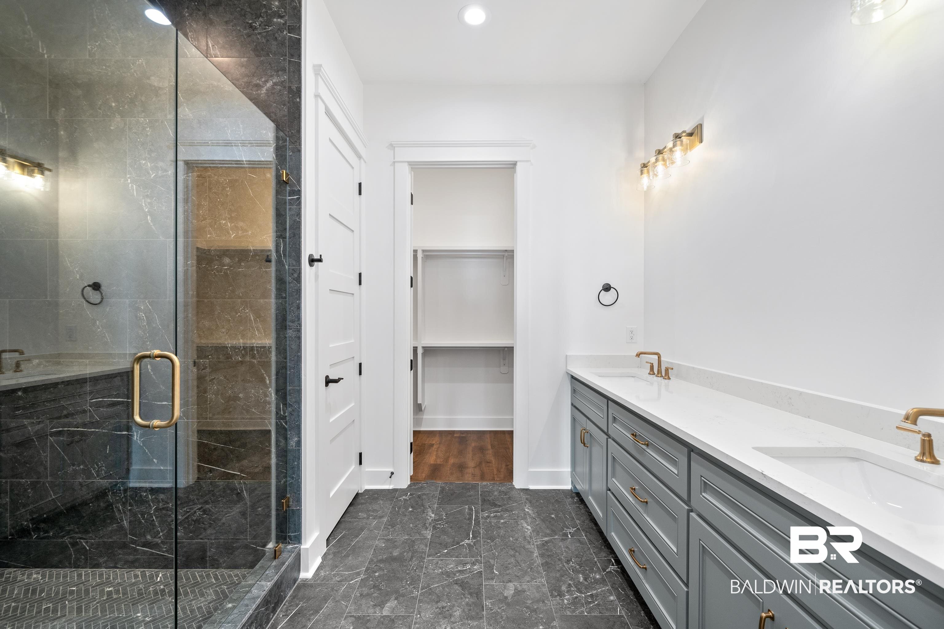 12453 County Road 1 Fairhope, AL 36532 - Photo 14 of 33 Bathroom featuring vanity and an enclosed shower