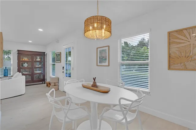 a view of dining room with furniture and wooden floor