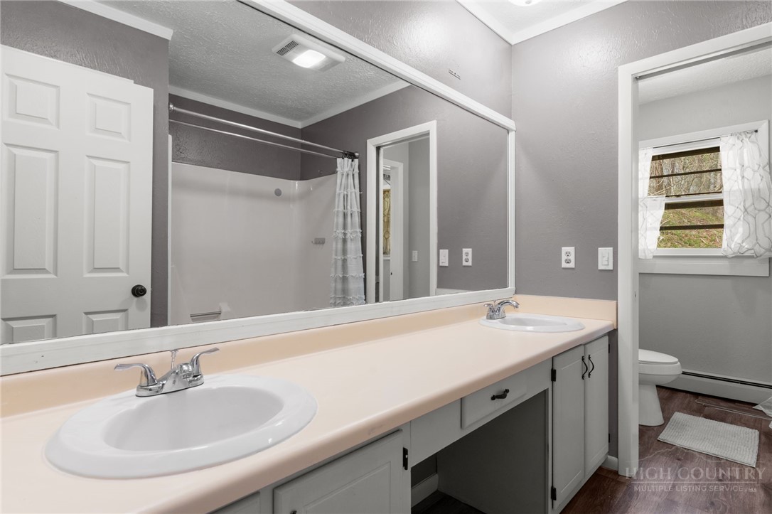 2345 Watauga River Road Sugar Grove, NC 28679 - Photo 22 of 50 a bathroom with a sink and a mirror