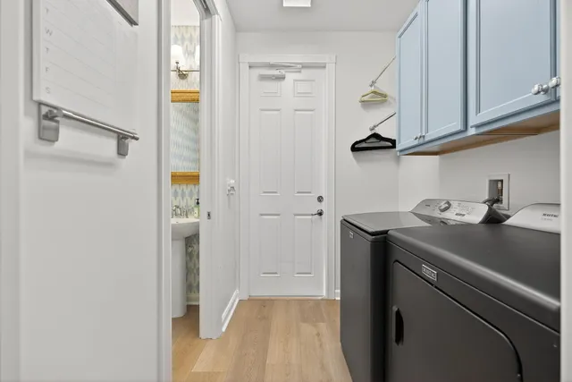 a kitchen with stainless steel appliances a stove sink and microwave
