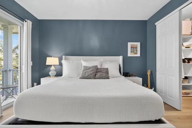 a bedroom with a bed and a couch