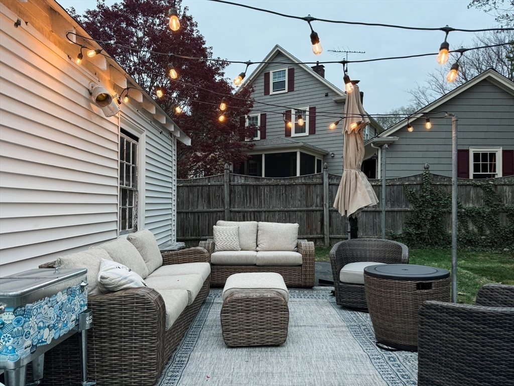 131 Damon Road Medford, MA 02155 - Photo 17 of 22 a view of a patio with couches chairs and a fire pit