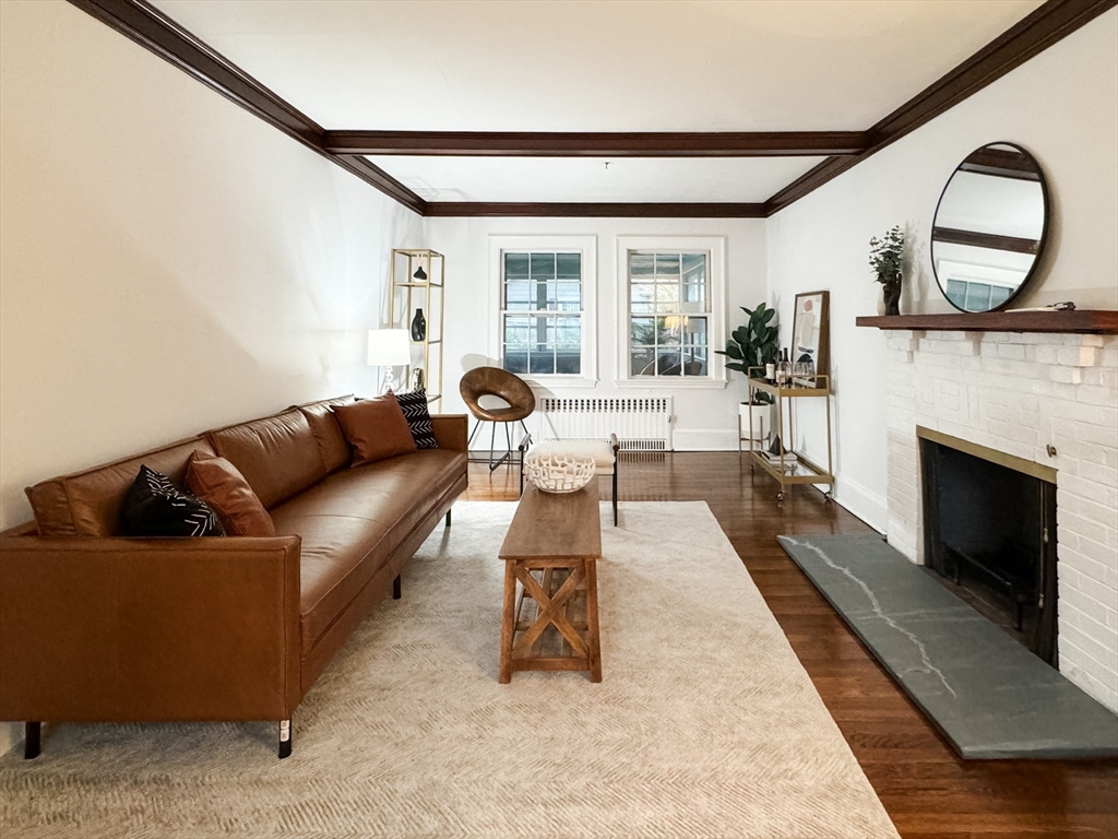 131 Damon Road Medford, MA 02155 - Photo 6 of 22 a living room with furniture a fireplace and a large window
