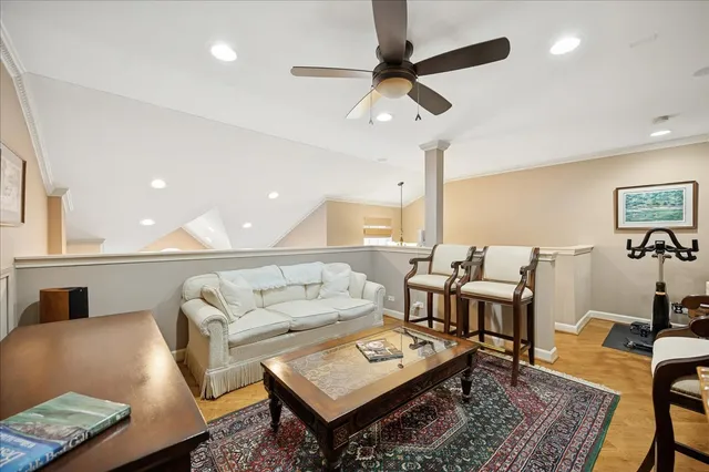 a living room with lots of furniture and a rug