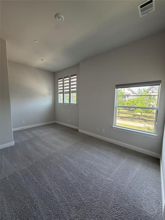 1049 Sarah Street Allen, TX 75013 - Photo 12 of 12 Spacious room featuring neutral carpeting and light gray wall tones