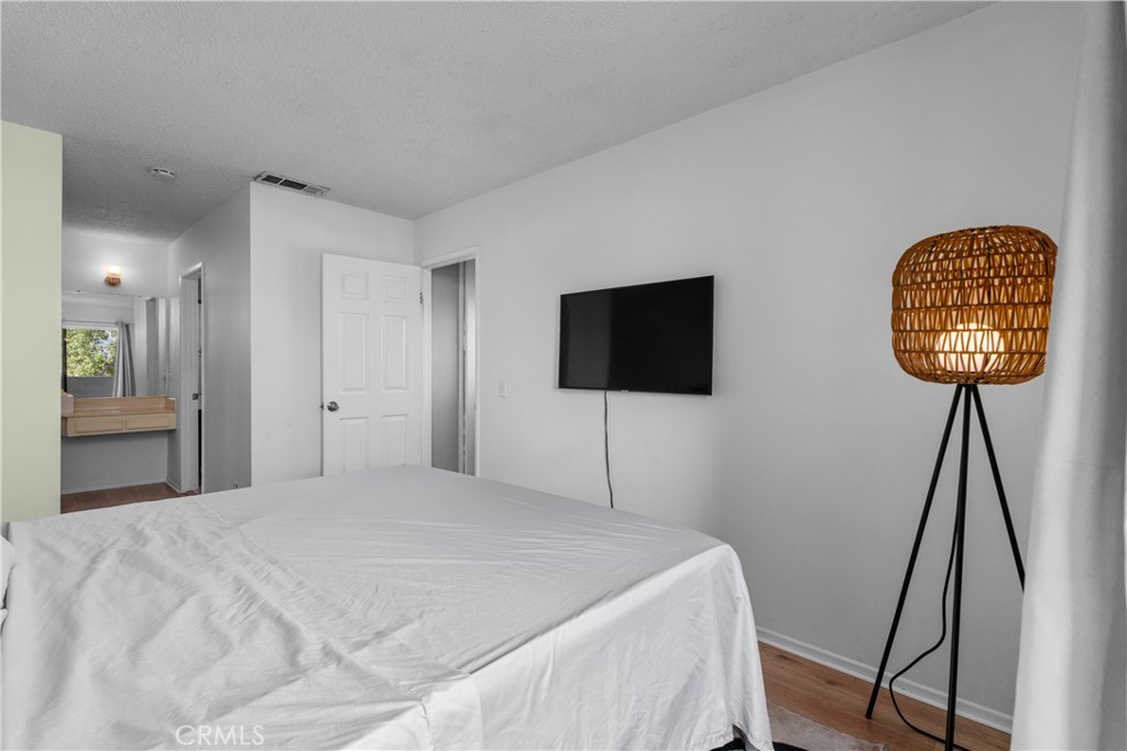 69646 Antonia Way Rancho Mirage, CA 92270 - Photo 41 of 50 a bedroom with a bed and a flat screen tv