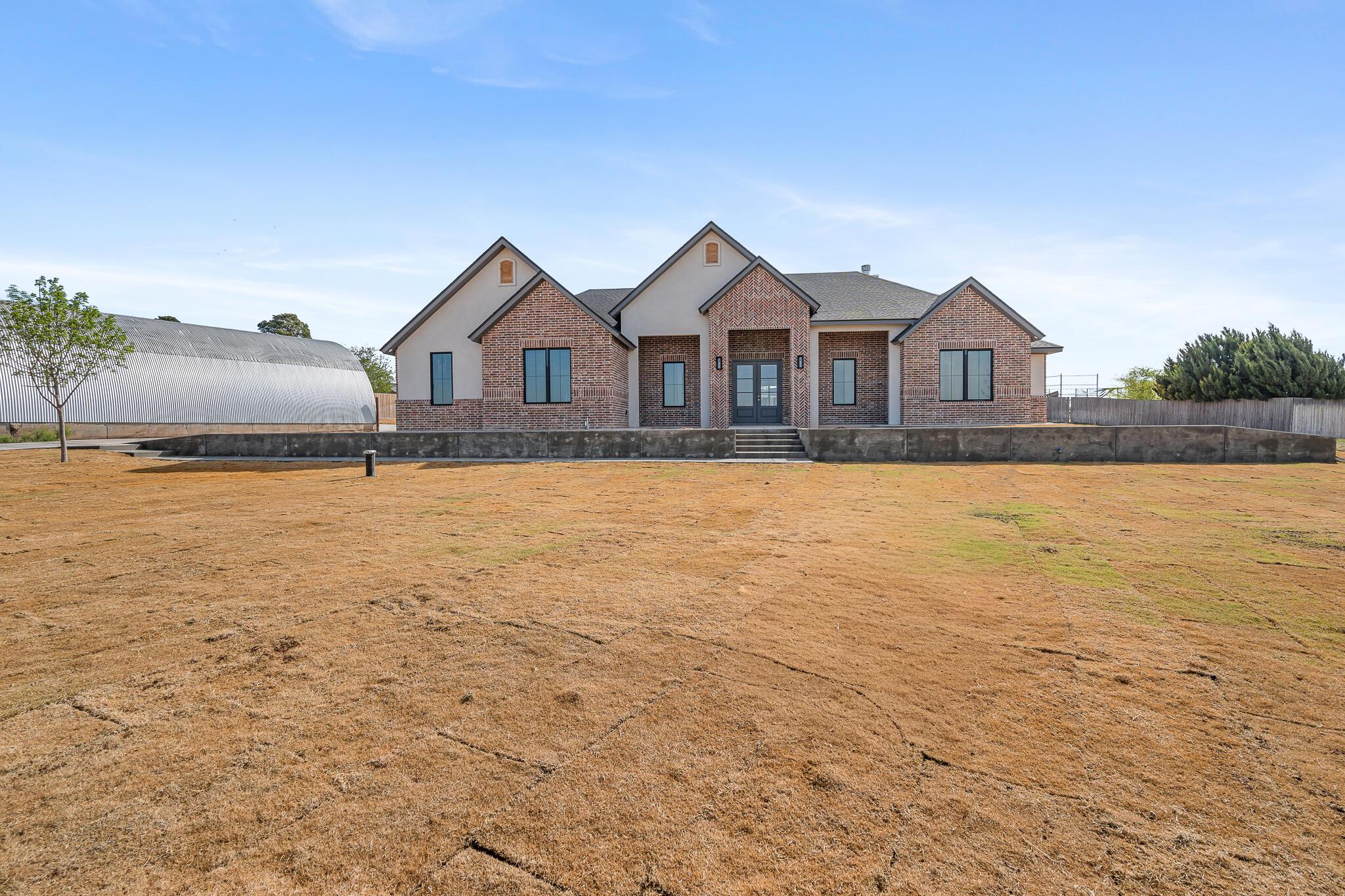 16551 Spring Lake Drive Canyon, TX 79015 - Photo 2 of 60 a front view of a house with a yard