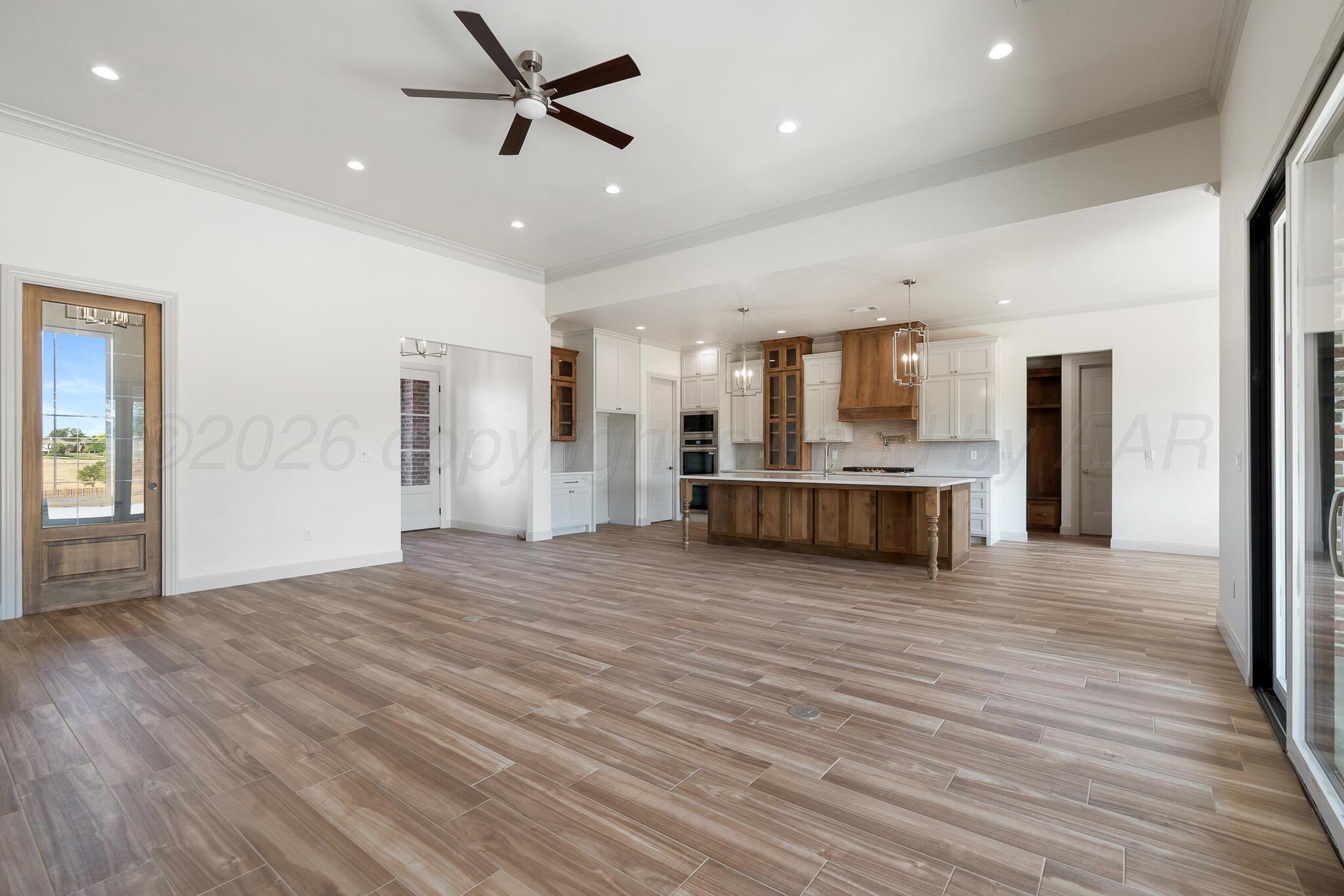 16551 Spring Lake Drive Canyon, TX 79015 - Photo 22 of 60 a view of a kitchen with a sink and a refrigerator