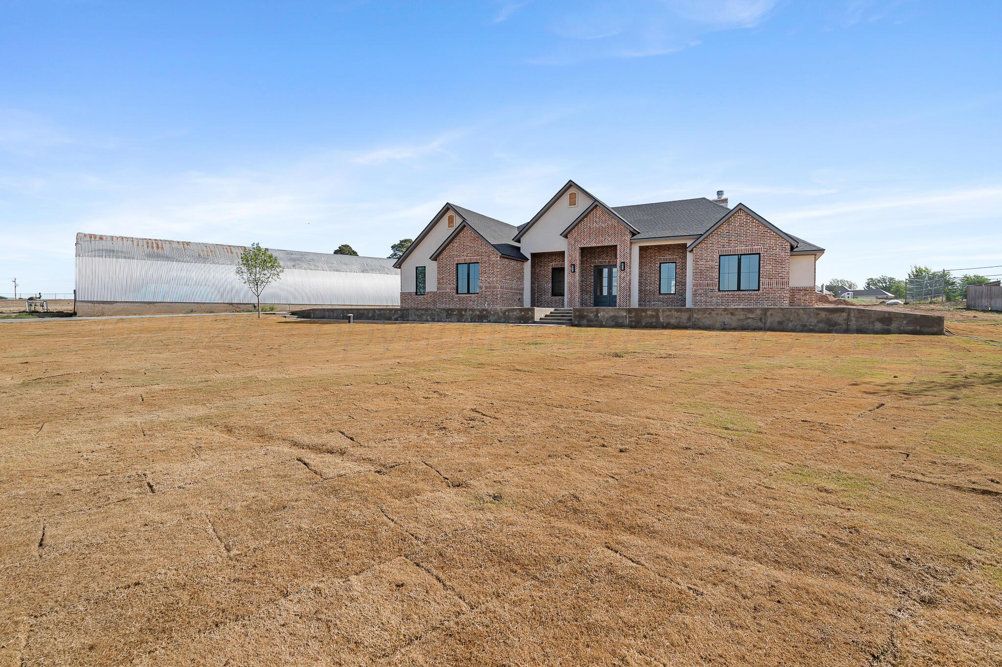 16551 Spring Lake Drive Canyon, TX 79015 - Photo 3 of 60 a front view of a house with a yard