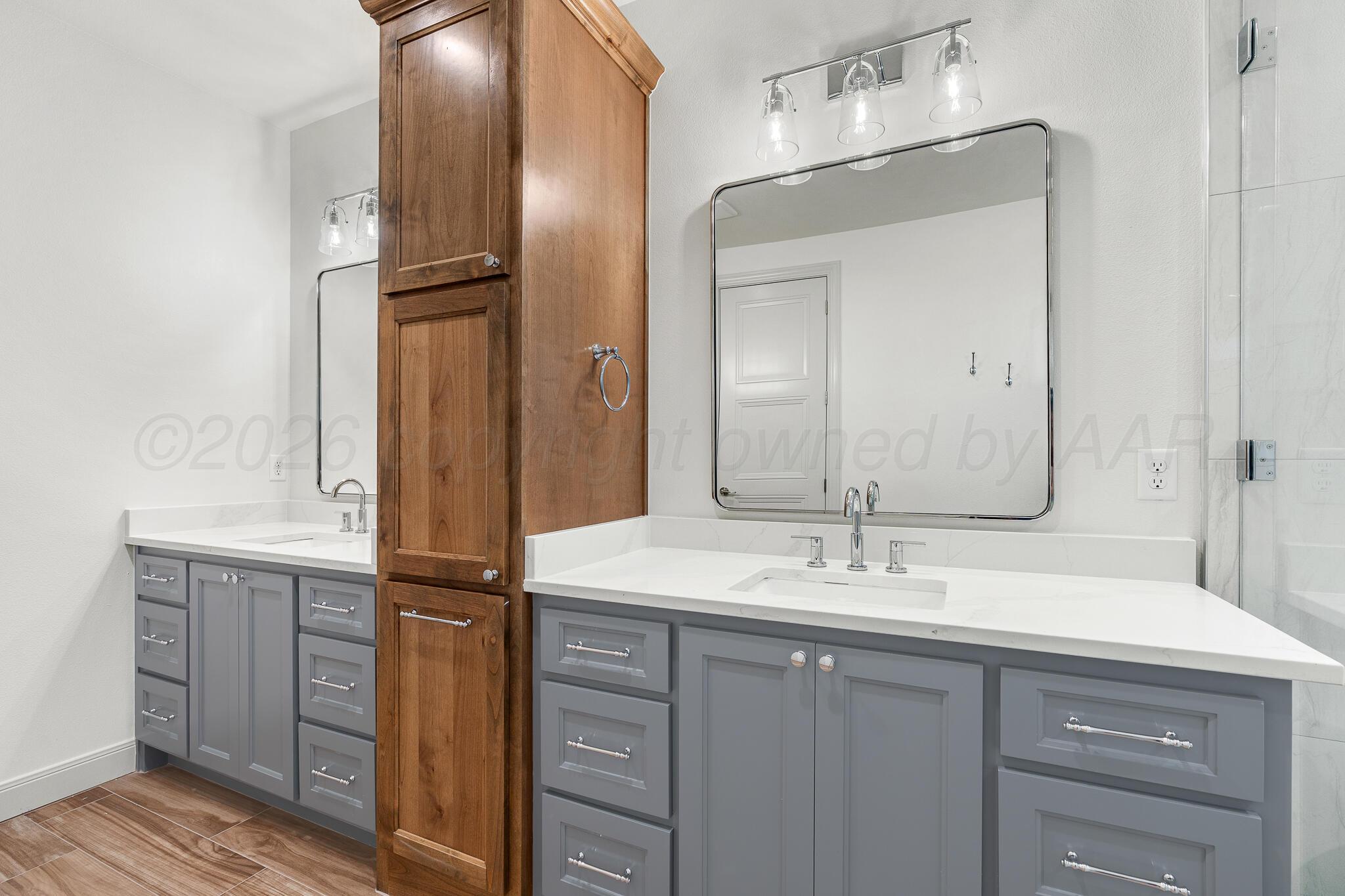 16551 Spring Lake Drive Canyon, TX 79015 - Photo 34 of 60 a bathroom with a double vanity sink and a mirror