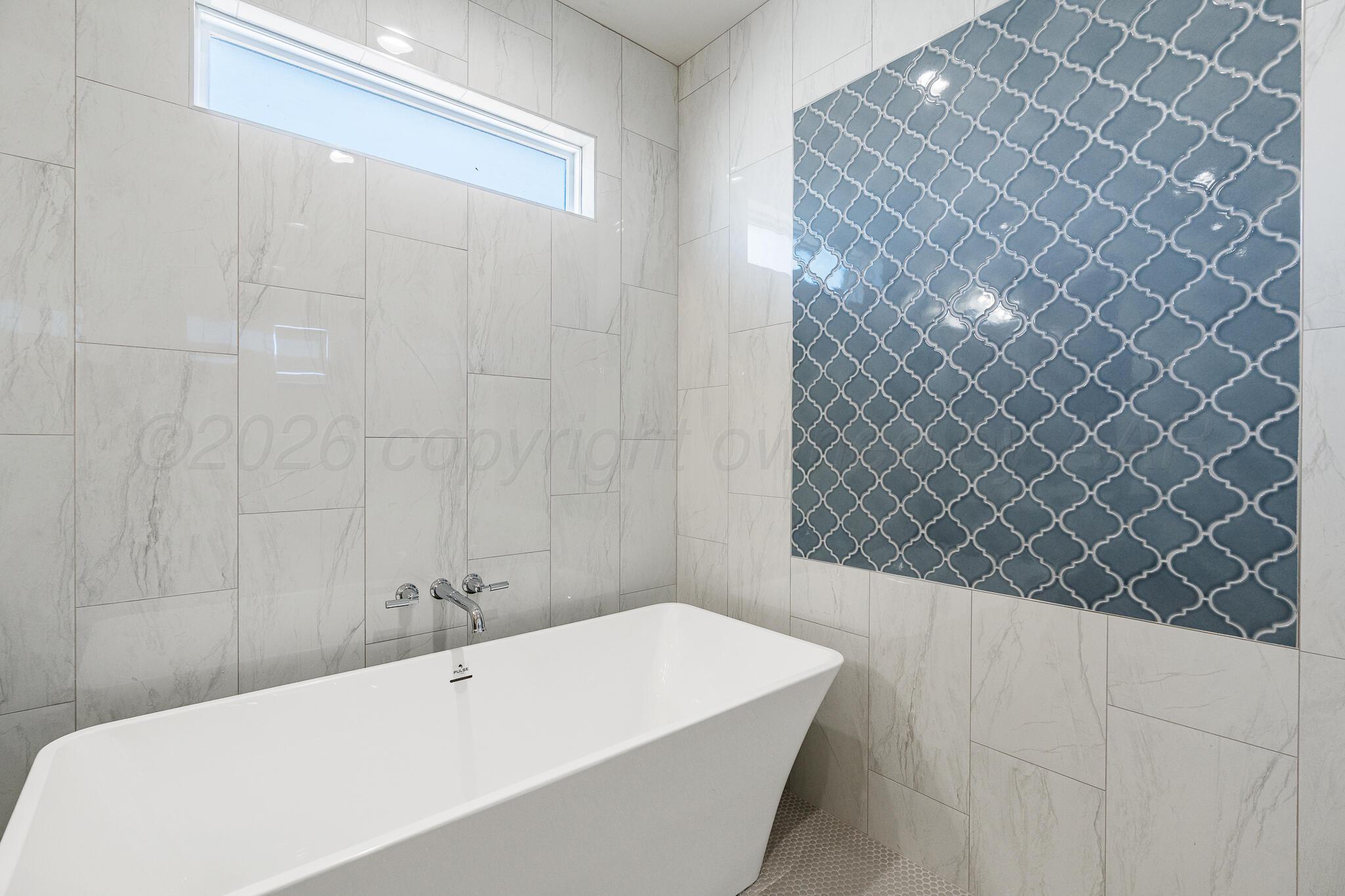 16551 Spring Lake Drive Canyon, TX 79015 - Photo 38 of 60 a bathroom with a bathtub