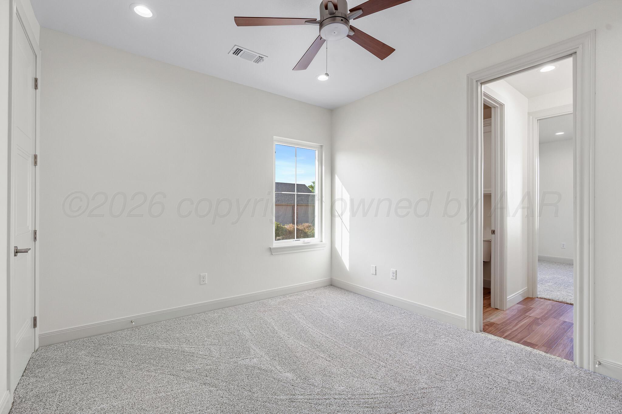 16551 Spring Lake Drive Canyon, TX 79015 - Photo 42 of 60 a view of a room with a ceiling fan and a window