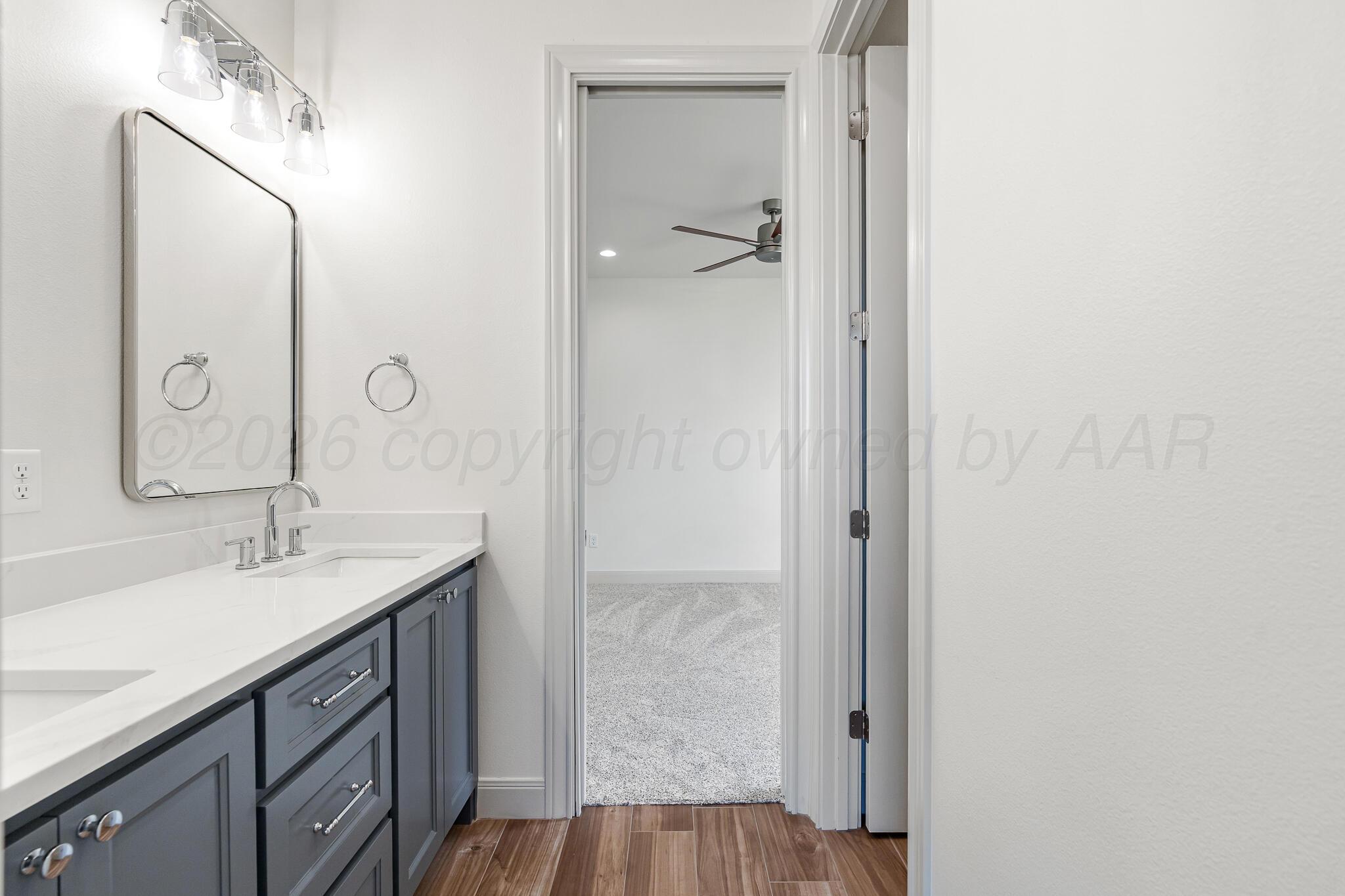 16551 Spring Lake Drive Canyon, TX 79015 - Photo 43 of 60 a bathroom with a sink and a mirror