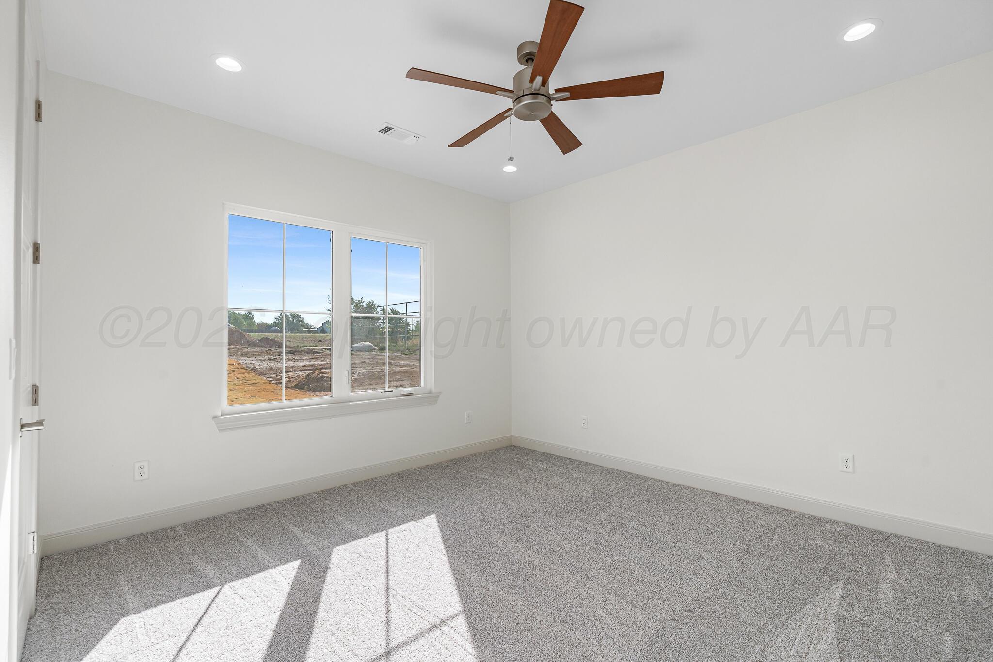 16551 Spring Lake Drive Canyon, TX 79015 - Photo 52 of 60 a view of an empty room with a window