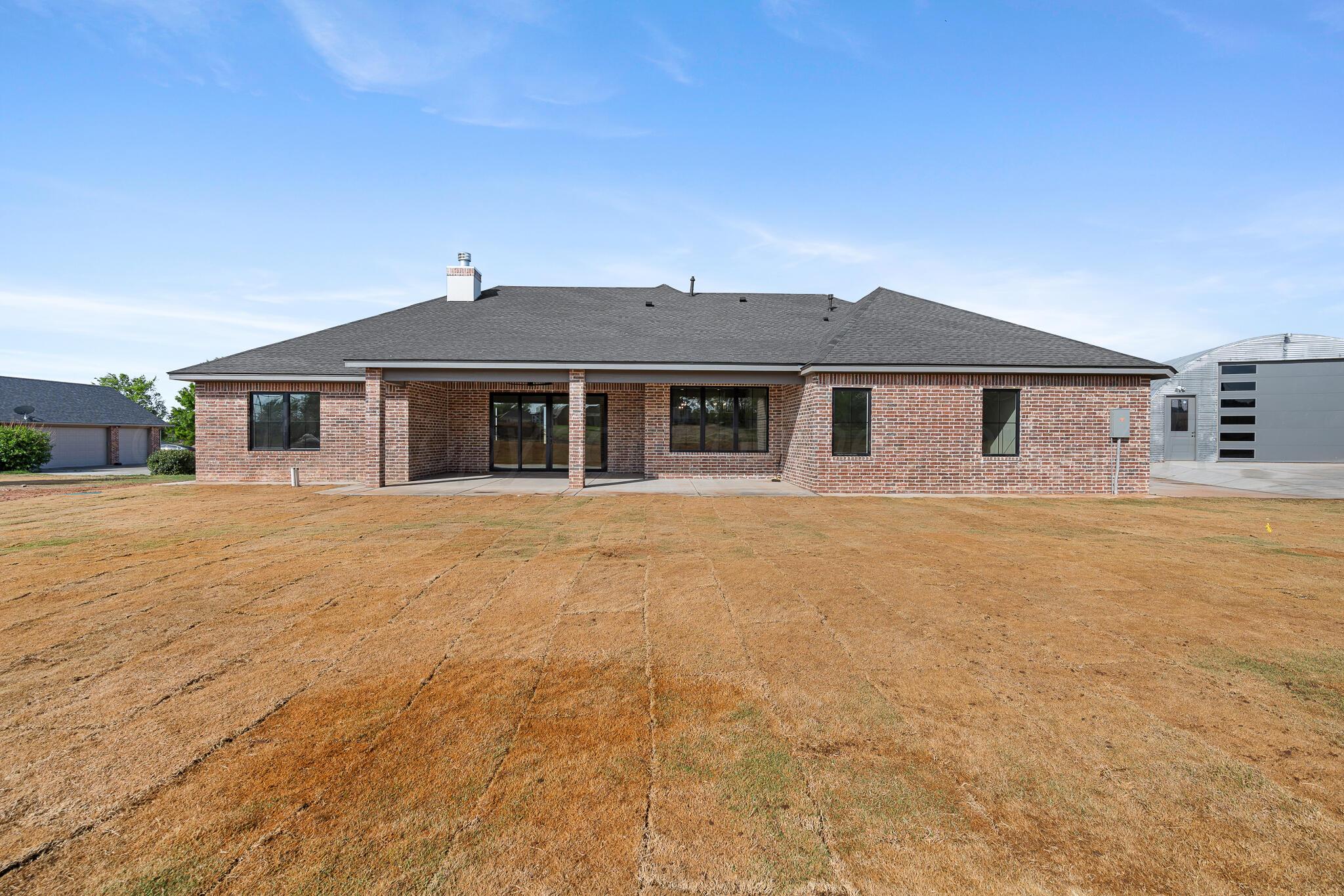16551 Spring Lake Drive Canyon, TX 79015 - Photo 57 of 60 a front view of a house with a garden