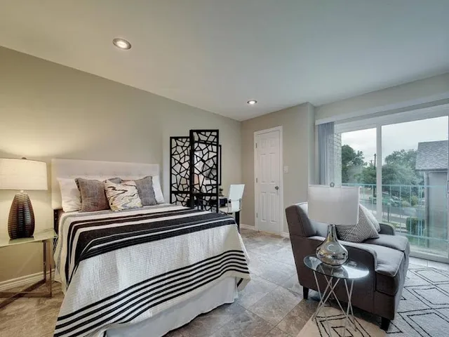 a bedroom with furniture and windows