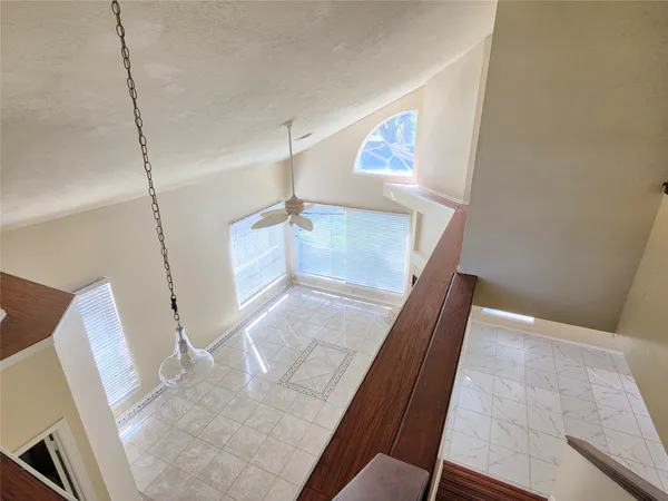 a view of a living room with furniture and a rug
