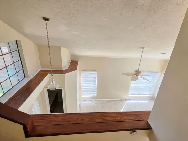 a view of a living room with furniture and a window