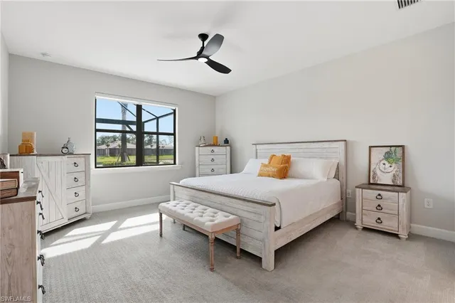 a bedroom with a bed and a dresser