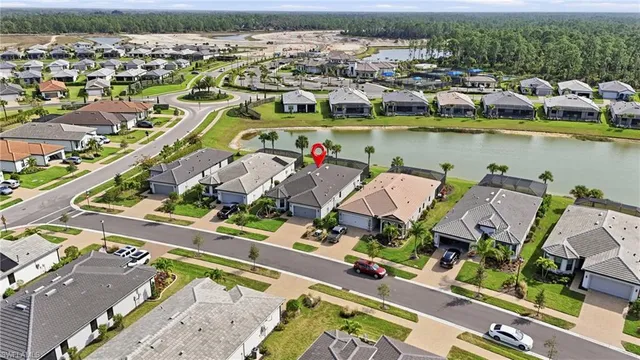 an aerial view of a house with a ocean view