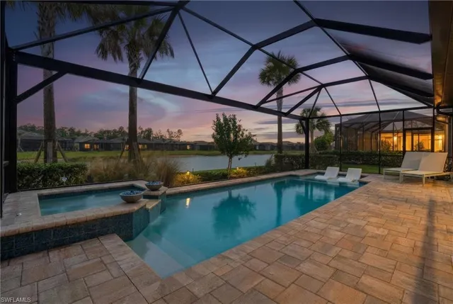 a view of a swimming pool with a patio