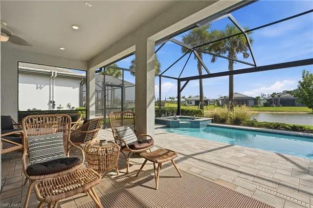 a view of swimming pool with outdoor seating