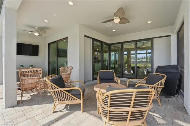 a view of a livingroom with furniture and a flat screen tv