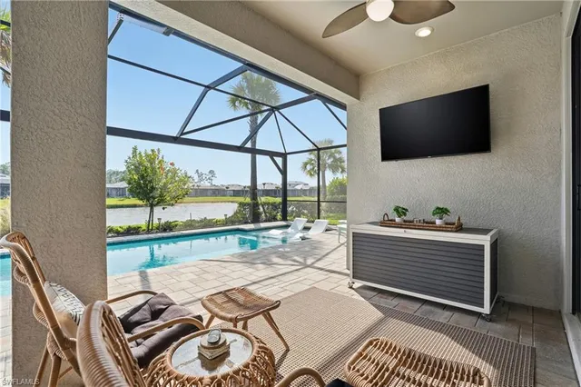 a bedroom with furniture and a flat screen tv
