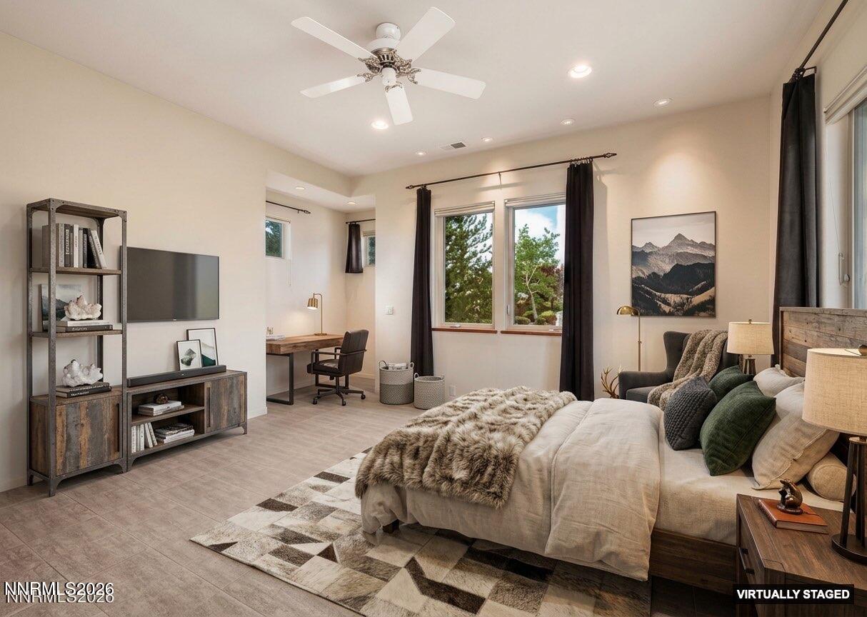 10123 Indian Ridge Drive Reno, NV 89511 - Photo 17 of 33 a bedroom with a bed and a flat screen tv