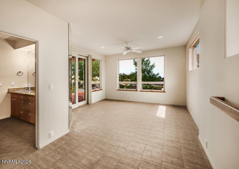 10123 Indian Ridge Drive Reno, NV 89511 - Photo 20 of 33 a view of an empty room with a kitchen and window