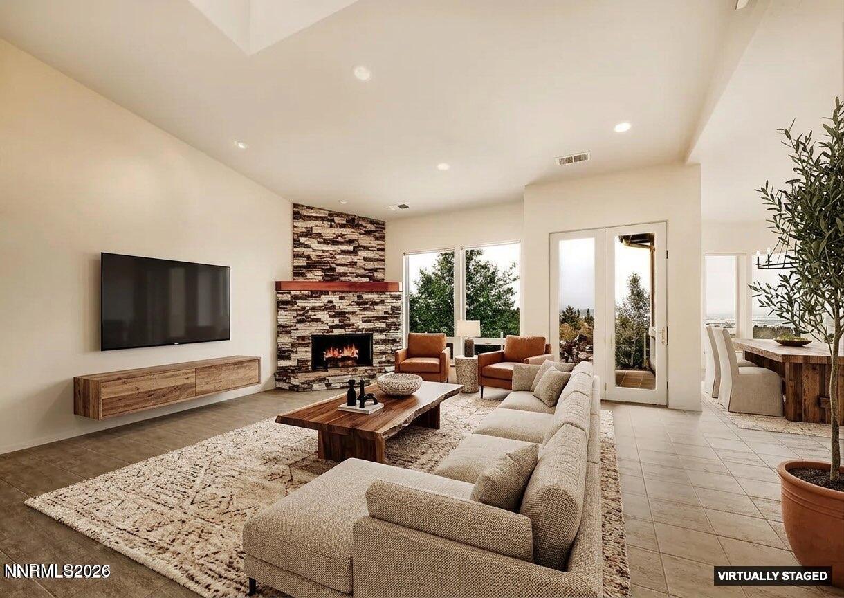 10123 Indian Ridge Drive Reno, NV 89511 - Photo 2 of 33 a living room with furniture and a flat screen tv