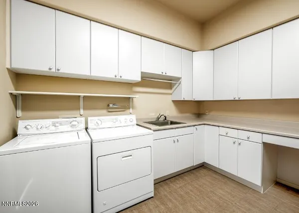 a kitchen with sink cabinets and utility