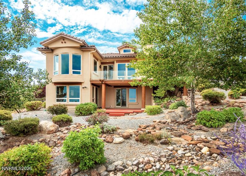 10123 Indian Ridge Drive Reno, NV 89511 - Photo 26 of 33 a front view of a house with garden