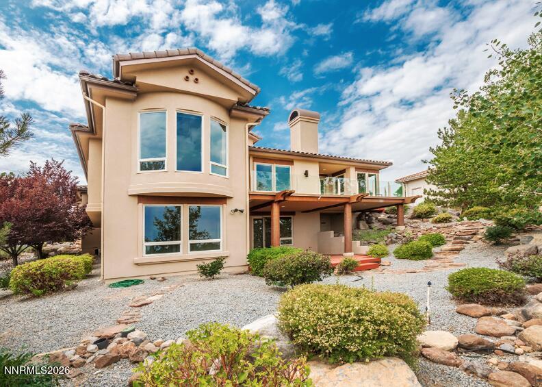 10123 Indian Ridge Drive Reno, NV 89511 - Photo 29 of 33 a front view of a house with a yard