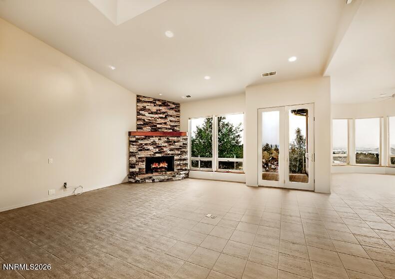 10123 Indian Ridge Drive Reno, NV 89511 - Photo 3 of 33 an empty room with furniture and a wooden floor