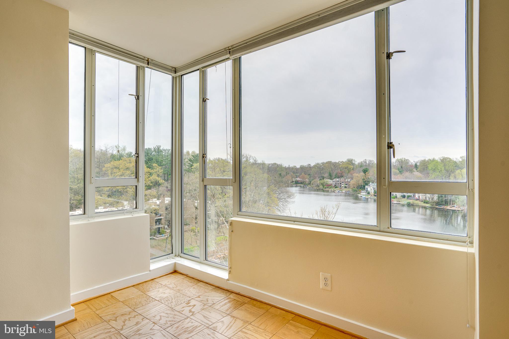 11400 Washington Plaza West, Unit 803 Reston, VA 20190 - Photo 11 of 43 a view of a room with a large window and a bed