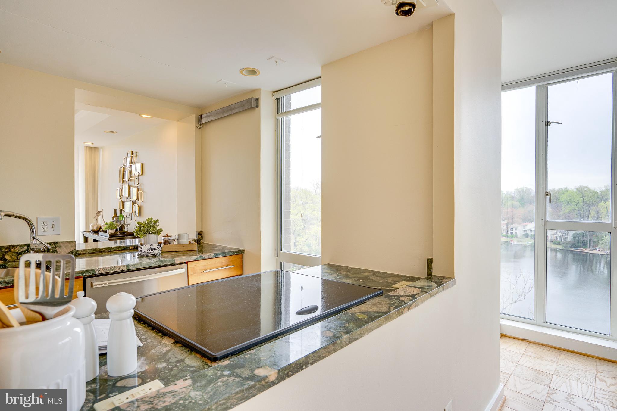 11400 Washington Plaza West, Unit 803 Reston, VA 20190 - Photo 12 of 43 a view of a living room and kitchen view